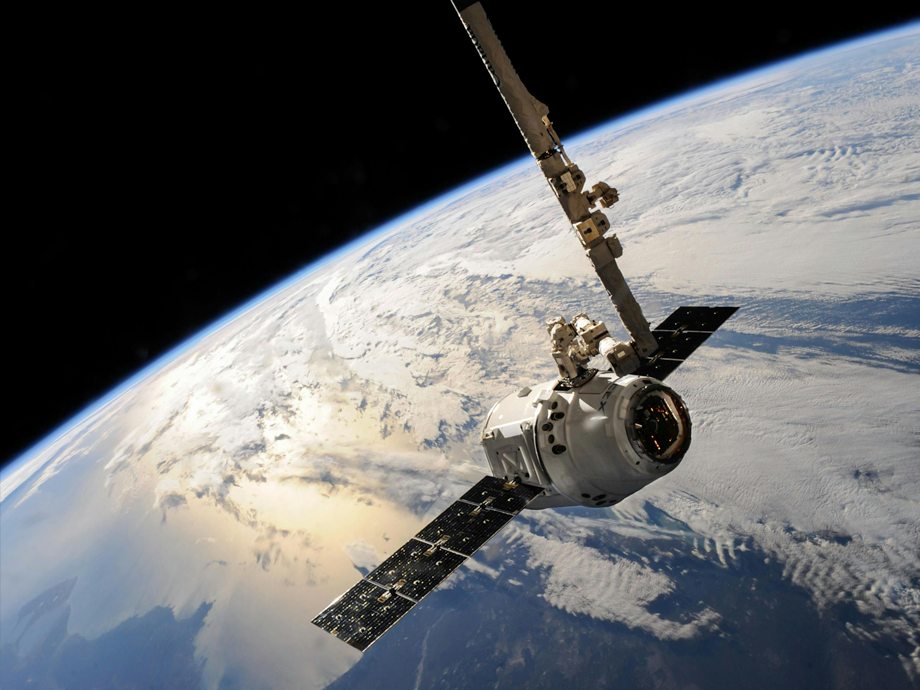 a stalite in space with earth as backdrop